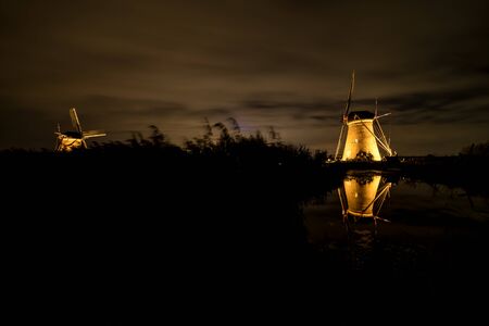 on the water there are several windmills in Kinderdijk in Hollandの写真素材