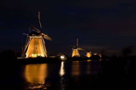 on the water there are several windmills in Kinderdijk in Hollandの写真素材