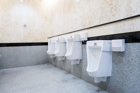 urinals in an old building for men onlyの写真素材