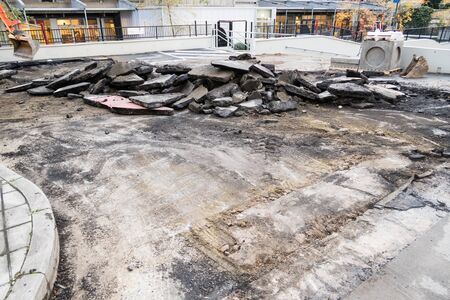 broken out asphalt has broken out with the excavator