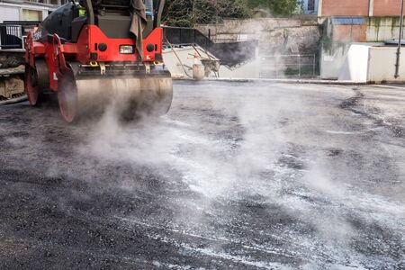 on asphalt asphalt rider there an asphalt roller to keep everything well pressedの写真素材