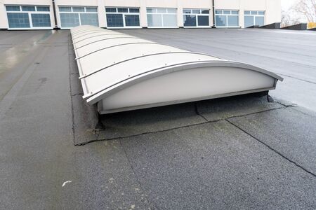 Plastic dome on a flat roof on a large building in the heart of the cityの写真素材