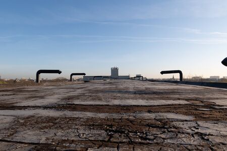 ventilators on the roof of a tall building in the industrial areaの写真素材