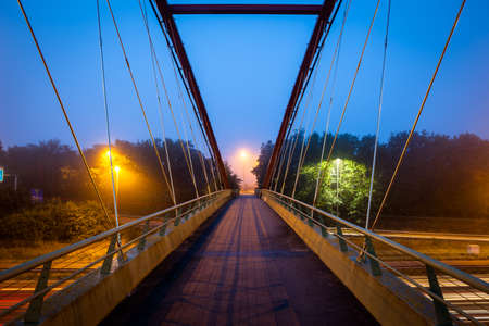 Bicycle bridge over the highway bacground.の写真素材