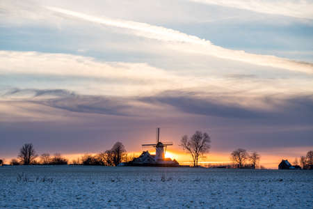 This old windmill is located in the national park in the Flemish Ardennes whit snow