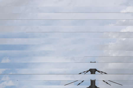 On a cloudy day in the station, this Iron Pole of the high mast of the trainの写真素材