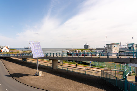 By the sea there is Solar panning on a poleの写真素材