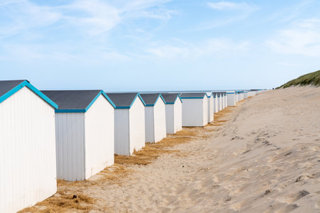 By the sea there is a row of beach huts side by sideの写真素材