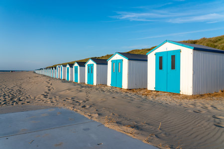 By the sea there is a row of beach huts side by sideの写真素材