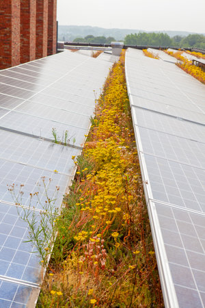 on a building in a residential area, there are eco solar panels on the roof