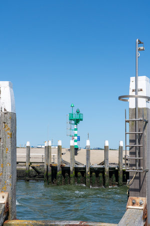 By harbor near the sea along the pier with a light houseの写真素材