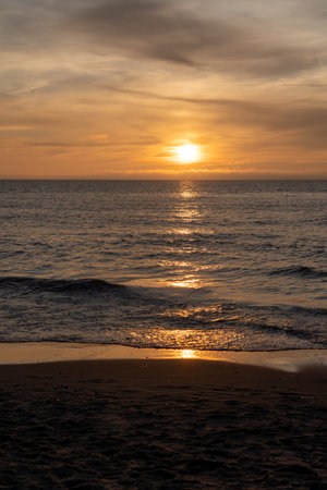 The end of a beautiful day with a beautiful sunset at the beachの写真素材