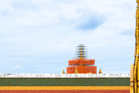 On a sunny day this Golden Temple is under construction in Bangkok