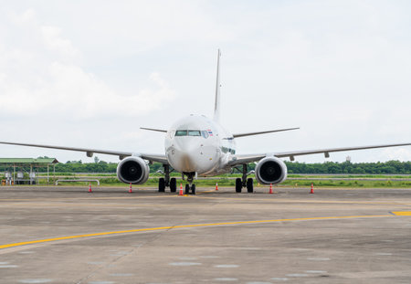 This plane is parked at Pattaya Airport in Thailand on a sunny day
