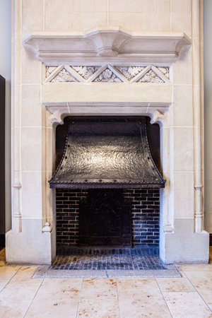 An antique stone fireplace in an old houseの写真素材