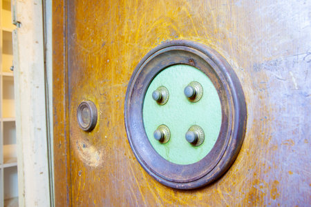 in the basement there is an old antique wooden safe with 4 alphabet safe with four wheelsの写真素材