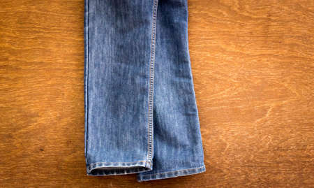 Jeans on a wooden background, Jeans textureの写真素材