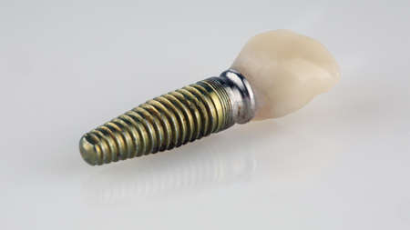 subject shooting of a temporary wearing crown on a replica implant on a white background