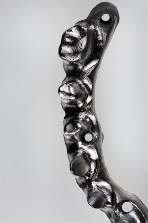 beautiful composition of a part of a titanium beam on a white background, top viewの写真素材