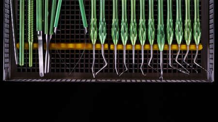 dental instruments for working with soft tissues during implantation on a black backgroundの写真素材