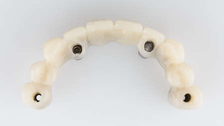 resin upper jaw prosthesis on white background top viewの写真素材