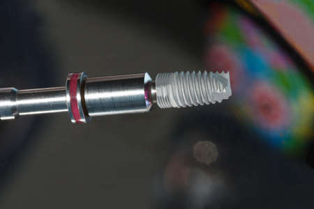 not a big dental implant of high quality against the background of beautiful reflection