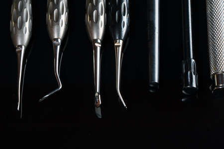 dental instruments for surgery and various manipulations, shot on black glass with reflectionの写真素材