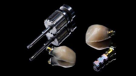 ceramic crowns on black glass with a screwdriver