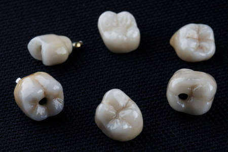 ceramic crowns on a black background