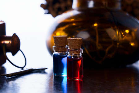 decor in the form of flasks with blue and red liquids on a creative backgroundの写真素材