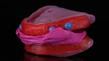 dental colored support pin with imprint on black background