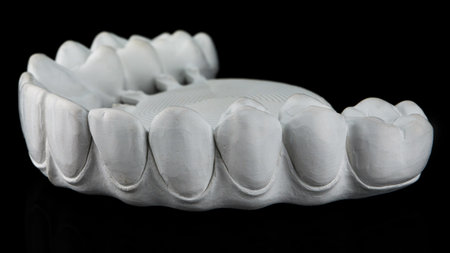 morphology and relief of a milled zircon dental prosthesis on a black backgroundの写真素材