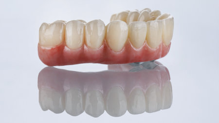 excellent composition of a dental prosthesis made of zircon or ceramic with a beautiful gum on white...