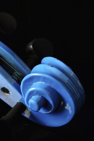 Blue violin scroll on a black backgroundの写真素材