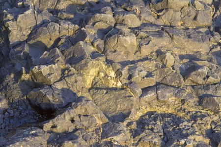 Close up view of a large rock with lots of texture