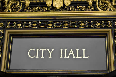 A city hall sign with ornate architectural detailsの写真素材