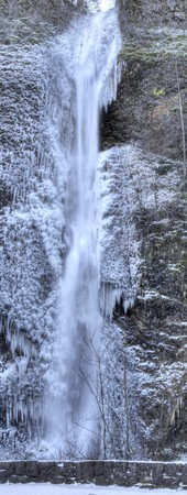 A panoramic view of Horsetail Falls frozen in winterの写真素材