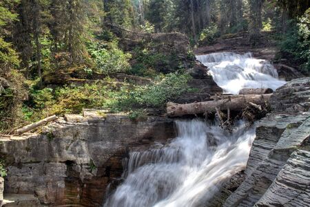 A waterfall in Glacier National Park, Montanaの写真素材