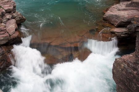 A beautiful waterfall in Glacier National Park, Montanaの写真素材