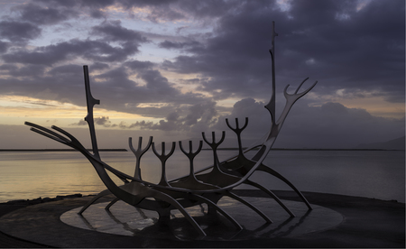 A modern public sculpture in Reykjavik of a Viking era long boatの写真素材