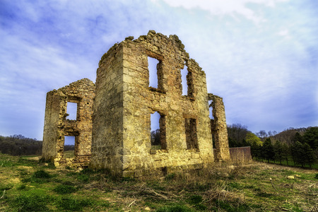 An old house stands in ruins on the Wisconsin prairieの写真素材