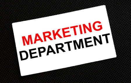 White card on the black background with text Marketing Department. Business conzeptの写真素材