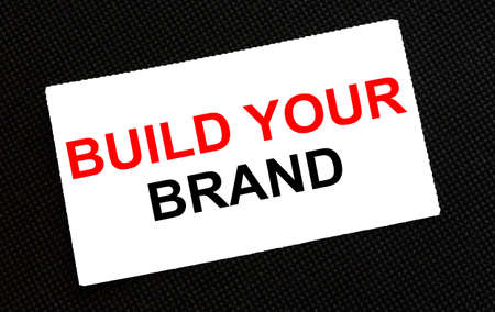 White card on the black background with text Build Your Brand. Business conzeptの写真素材