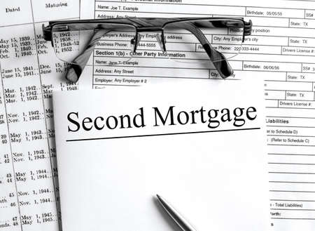 Paper with text Second Mortgage on a financial tables with glasses. Business and financial conzeptの写真素材