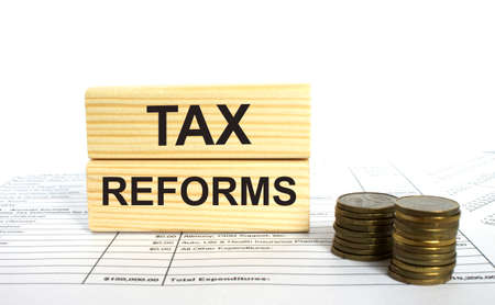 Wooden block with text Tax Reforms.の写真素材