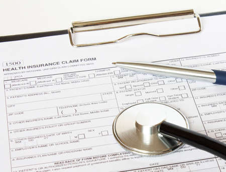 Prescription form lying on table with stethoscope and silver pen.の写真素材