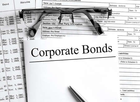 Paper with text Corporate Bonds a financial tables with glassesの写真素材