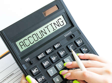 A calculator with word Accounting on the displayの写真素材