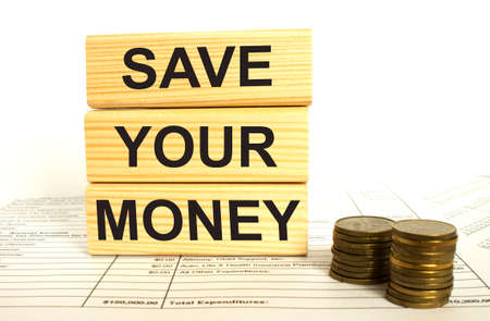Coin with Wooden blocks text Save Your Money. Business and finance concept.の写真素材