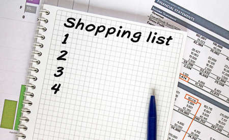 Text Shoping List. Financial planning on notebook, business and finance concept.の写真素材